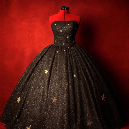 Black corseted ball gown with rhinestone star details for a masquerade event