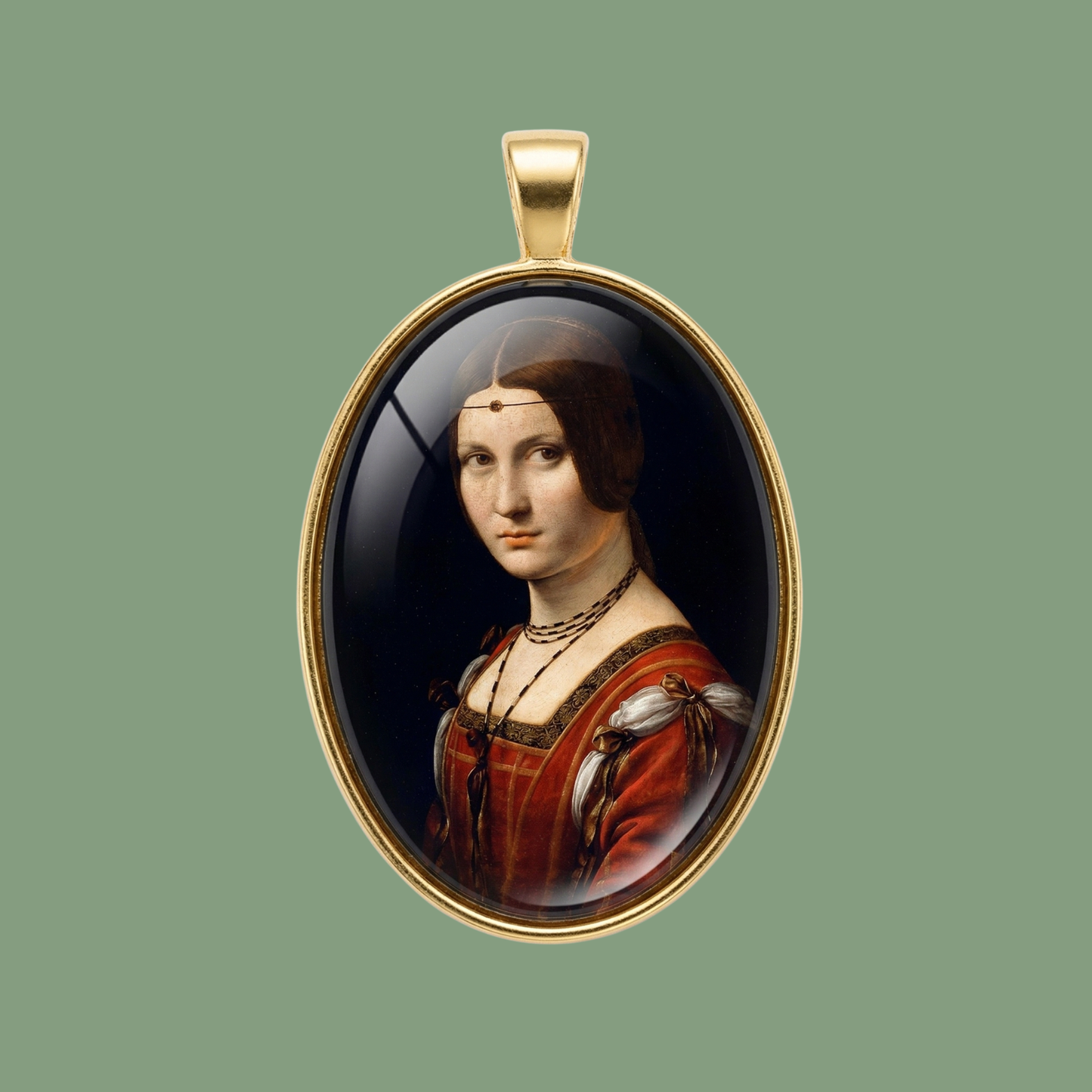 Gold-toned brass oval medallion featuring the Renaissance portrait La Belle Ferronnière, protected by a glass dome, on a sage green background.