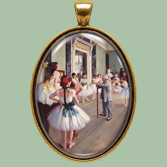 Edgar Degas ballet class medallion necklace in glass and antique brass, 40x30 mm, shown on a muted sage green background.