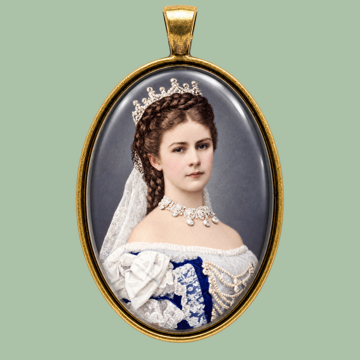 Empress Elisabeth of Austria Sissi portrait medallion necklace in glass and gold-toned brass, 40x30 mm, shown on a sage green background.