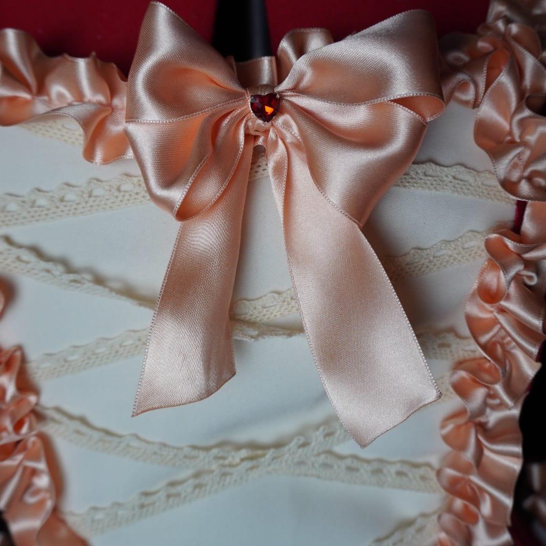 Ivory bodice and satin bow detail on the Venetian Carnival gown