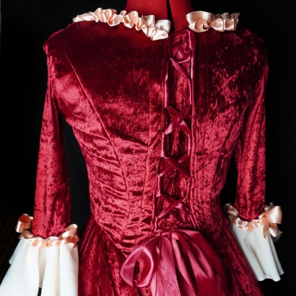 Lace-up back of the red velvet Venetian Carnival gown