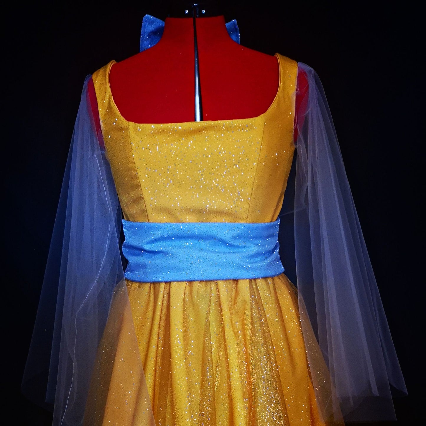Full-length Grand Duchess imperial ballroom gown in amber and gold, inspired by Once Upon a December, featuring a voluminous floor-length skirt.